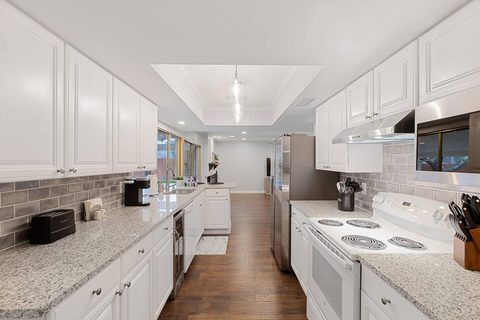 Kitchen: Bright and inviting space with sleek countertops and modern appliances awaits your culinary adventures!