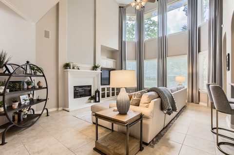 Living Room: Sunlit haven with elegant decor, plush seating, and vibrant greenery for relaxation!